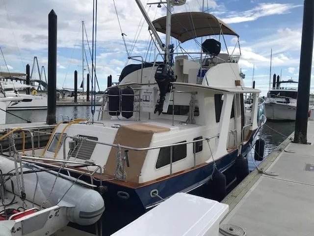 Slide: The Image of 2000 Pacific Seacraft 38T Fast Trawler docked at marina. - 2