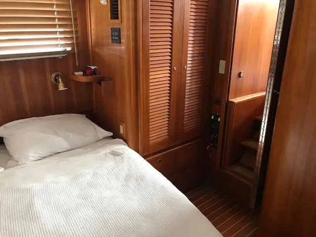 Slide: The Image of Cozy cabin interior of 2000 Pacific Seacraft 38T Fast Trawler with wooden furnishings. - 20