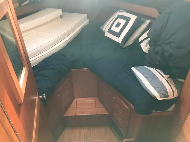 Slide: The Image of Cozy cabin interior of 2000 Pacific Seacraft 38T Fast Trawler with bedding and cushions. - 21