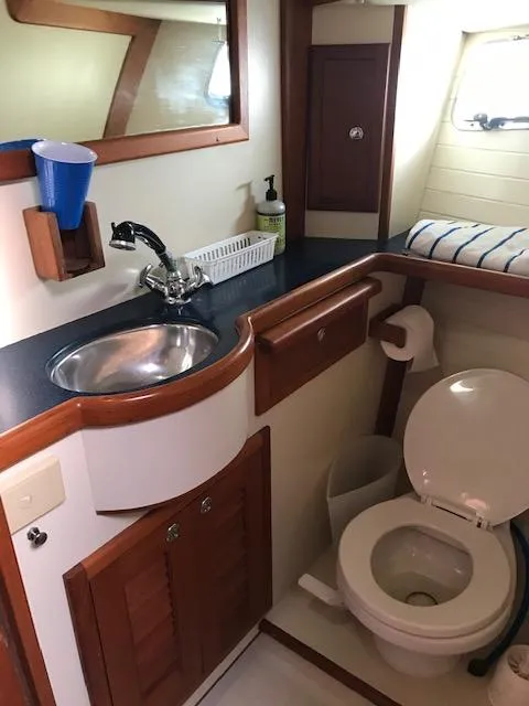 Slide: The Image of Bathroom interior of 2000 Pacific Seacraft 38T Fast Trawler with sink and toilet. - 22