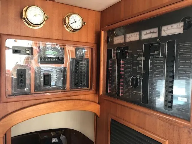 Slide: The Image of Control panel of a 2000 Pacific Seacraft 38T Fast Trawler with gauges and switches. - 23