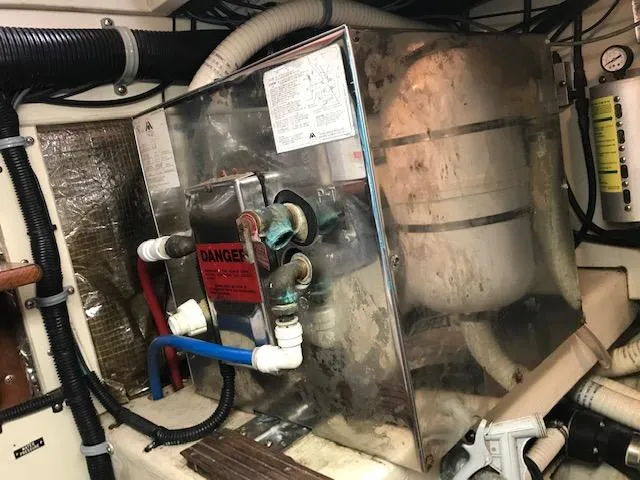 Slide: The Image of Engine room of 2000 Pacific Seacraft 38T Fast Trawler with machinery and pipes. - 26