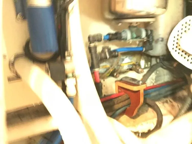 Slide: The Image of Engine room of 2000 Pacific Seacraft 38T Fast Trawler with visible pipes and components. - 29