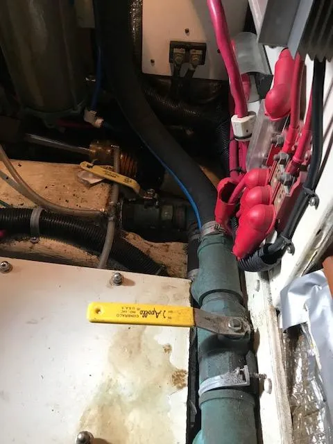 Slide: The Image of Engine room of 2000 Pacific Seacraft 38T Fast Trawler with visible valves and wiring. - 31