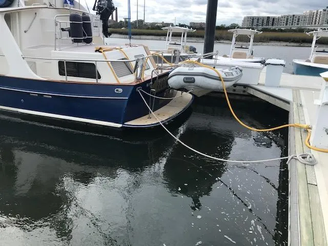Slide: The Image of Pacific Seacraft 38T Fast Trawler docked with inflatable dinghy, 2000 model. - 8