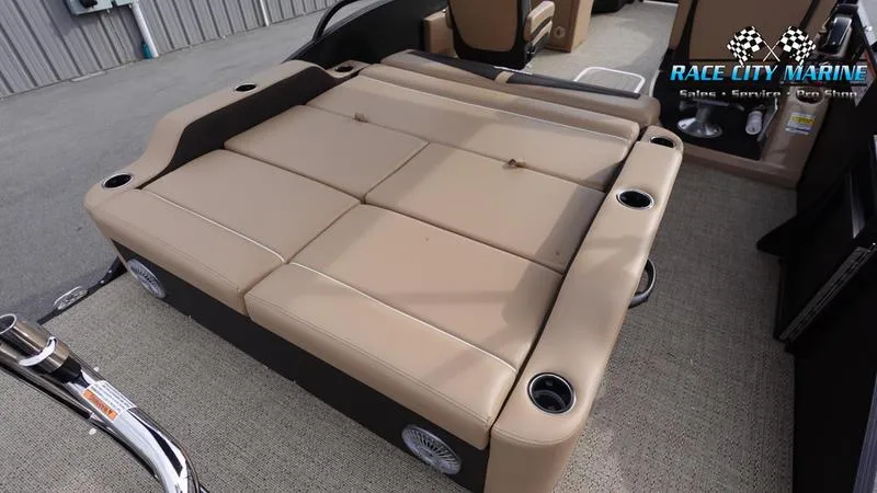 Slide: The Image of 2025 Barletta Cabrio 22UC boat interior with tan seating and cup holders. - 13