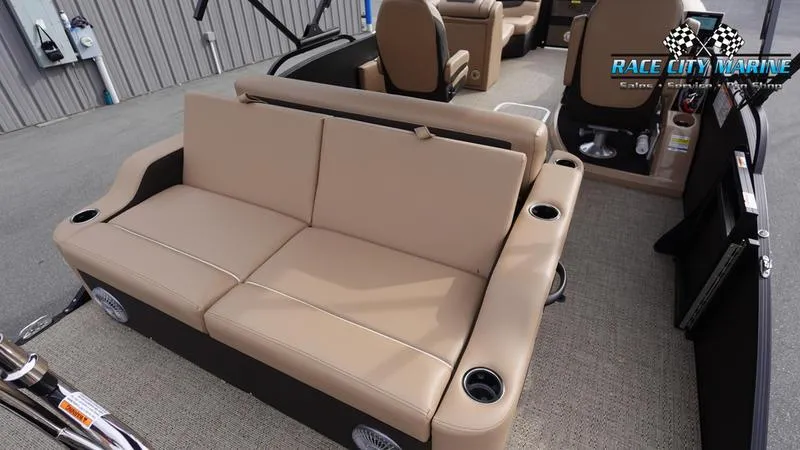 Slide: The Image of 2025 Barletta Cabrio 22UC pontoon boat interior with beige seating and cup holders. - 14