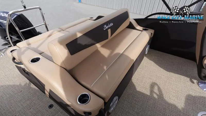 Slide: The Image of 2025 Barletta Cabrio 22UC boat with tan seating and cup holders. - 17