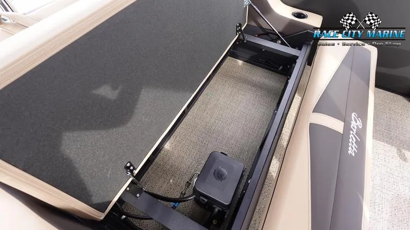 Slide: The Image of Barletta Cabrio 22UC 2025 boat interior storage compartment, Race City Marine branding. - 18