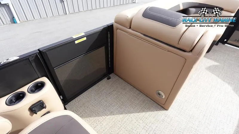 Slide: The Image of 2025 Barletta Cabrio 22UC interior with beige seating and cup holders. - 21