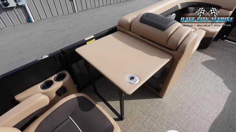 Slide: The Image of 2025 Barletta Cabrio 22UC boat interior with beige seating and table. - 23