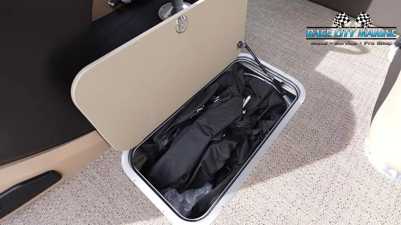 Slide: The Image of 2025 Barletta Cabrio 22UC storage compartment with black cover inside. - 25