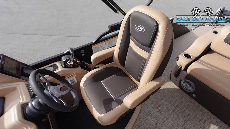 Slide: The Image of 2025 Barletta Cabrio 22UC boat interior with steering wheel and captain's chair. - 26