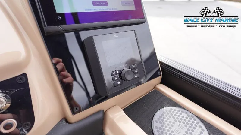 Slide: The Image of 2025 Barletta Cabrio 22UC dashboard with control panel and Race City Marine logo. - 30