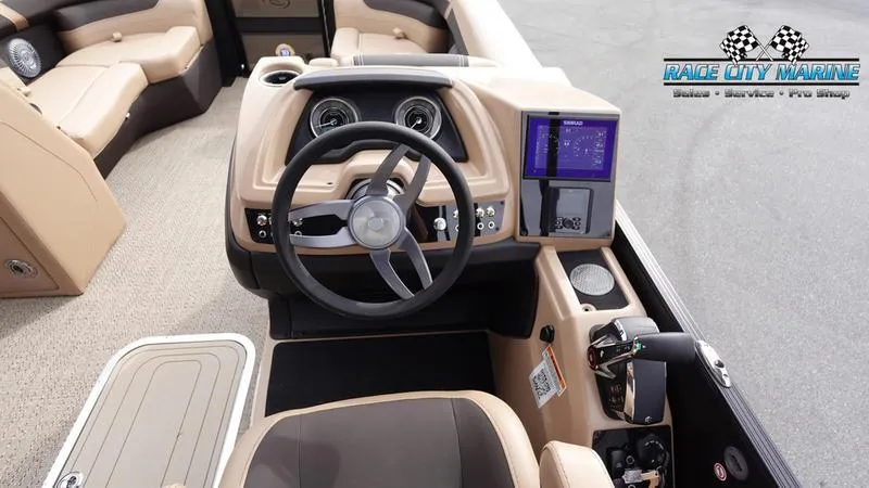 Slide: The Image of 2025 Barletta Cabrio 22UC boat interior with steering wheel and dashboard controls. - 37