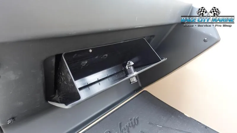 Slide: The Image of 2025 Barletta Cabrio 22UC storage compartment detail with Race City Marine logo. - 38