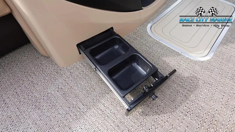 Slide: The Image of Barletta Cabrio 22UC 2025 boat with retractable cup holders on carpeted floor. - 39