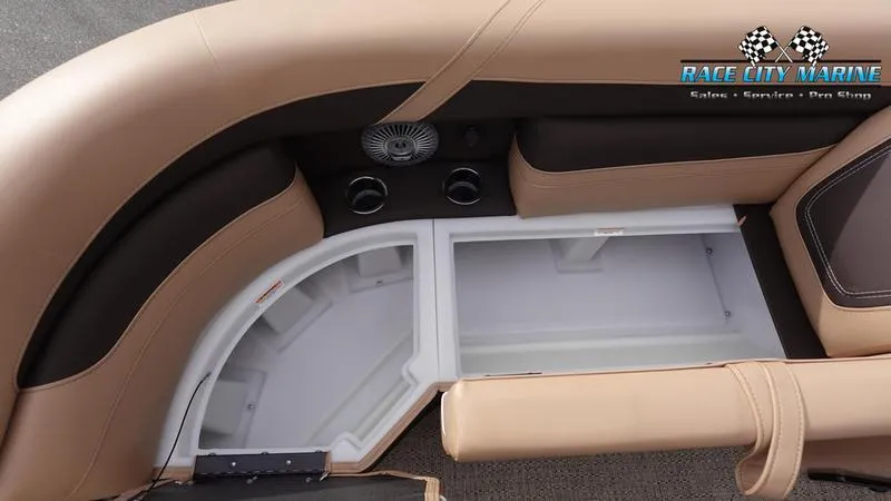 Slide: The Image of 2025 Barletta Cabrio 22UC boat interior with storage compartment and cup holders. - 43