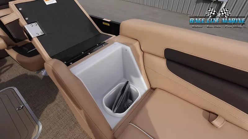 Slide: The Image of Barletta Cabrio 22UC 2025 boat interior with storage compartment and beige seating. - 45