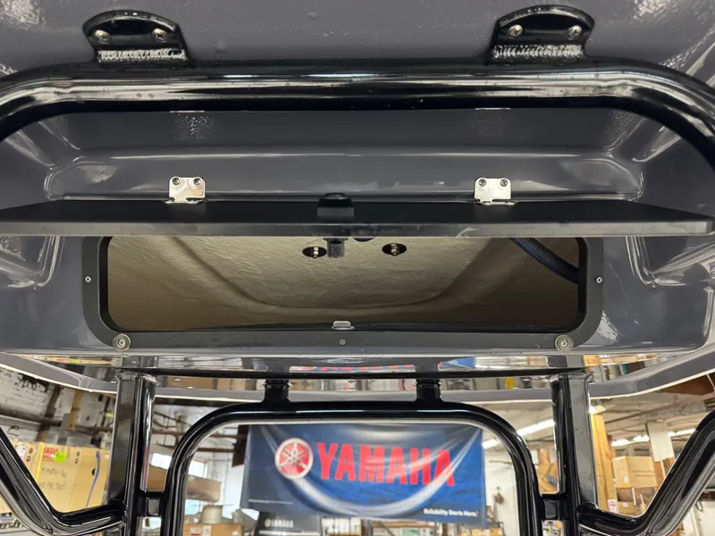 Slide: The Image of 2022 Robalo R230 Center Console boat interior with Yamaha banner in background. - 10