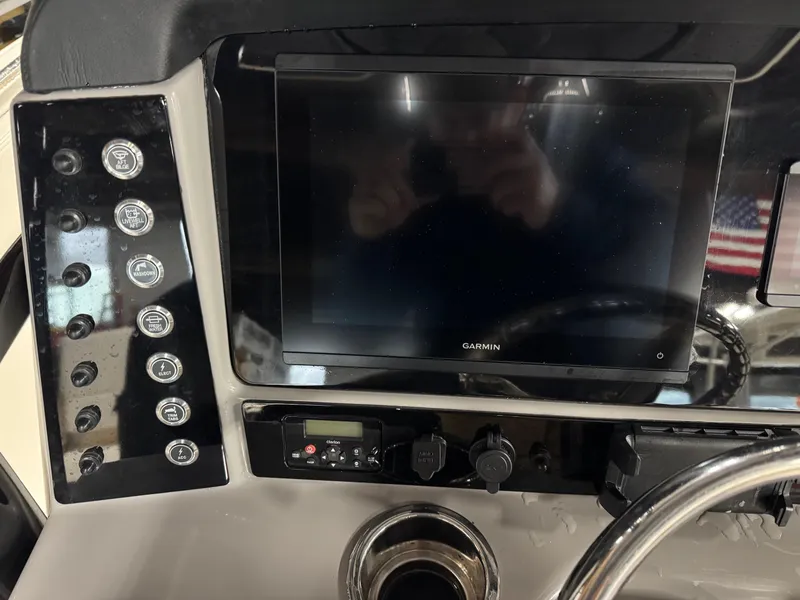 Slide: The Image of 2022 Robalo R230 Center Console dashboard with Garmin display and control panel. - 11