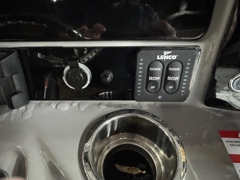 Slide: The Image of Close-up of 2022 Robalo R230 Center Console dashboard with Lenco controls. - 14