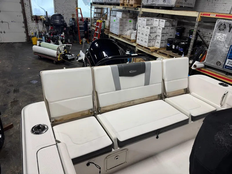 Slide: The Image of 2022 Robalo R230 Center Console boat interior in a workshop setting. - 16