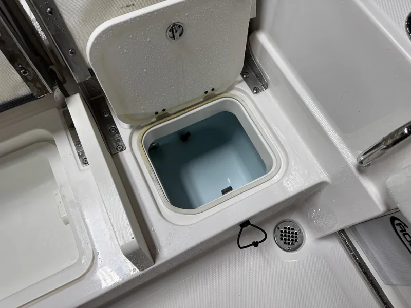 Slide: The Image of 2022 Robalo R230 Center Console boat storage compartment detail. - 20