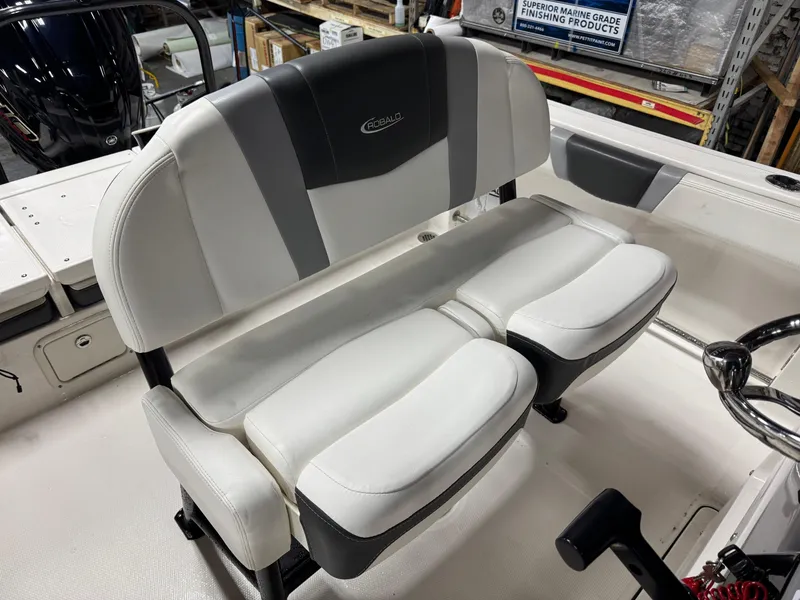 Slide: The Image of 2022 Robalo R230 Center Console boat seat with white and gray upholstery. - 22