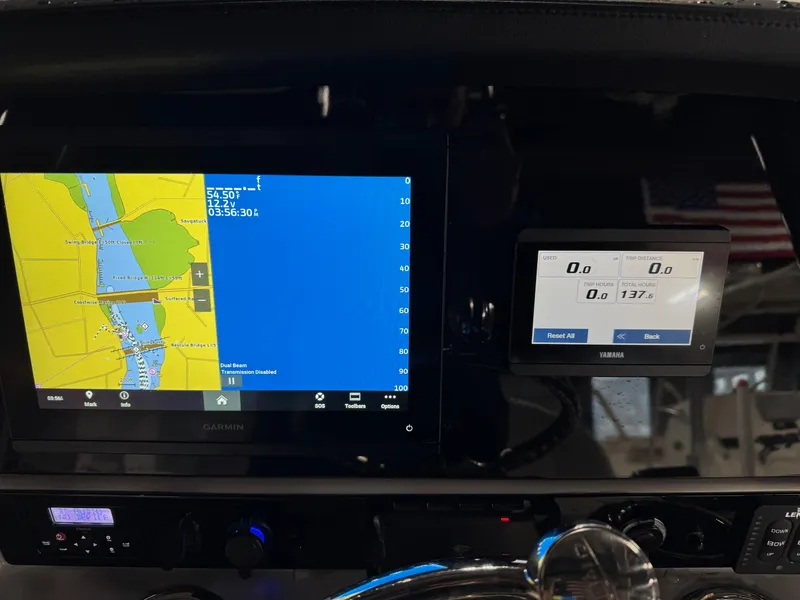 Slide: The Image of Dashboard of 2022 Robalo R230 Center Console with navigation and control screens. - 28