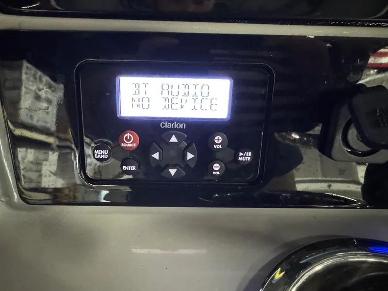 Slide: The Image of Clarion audio system on 2022 Robalo R230 Center Console boat dashboard. - 30