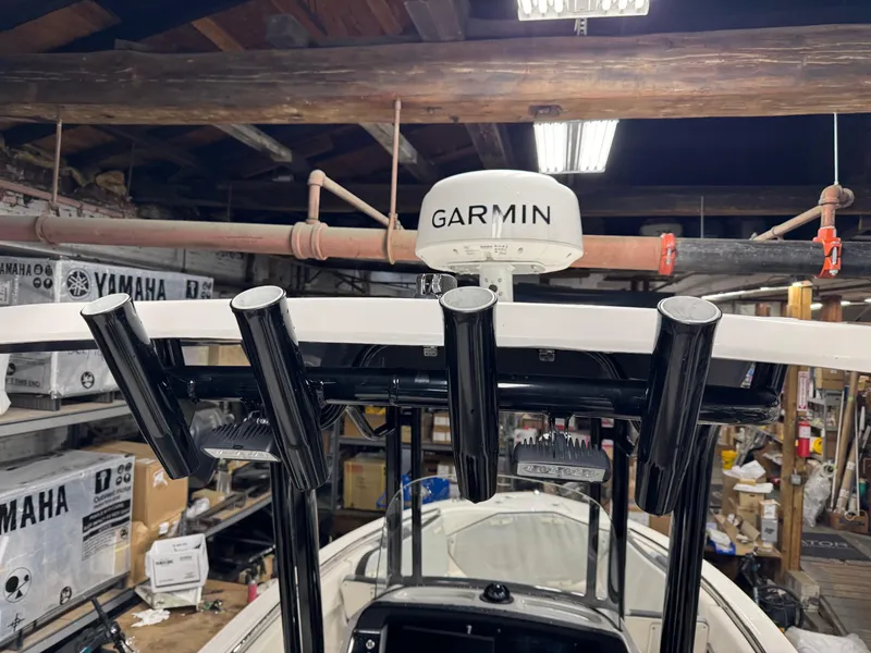 Slide: The Image of 2022 Robalo R230 Center Console boat with Garmin equipment in a workshop. - 31