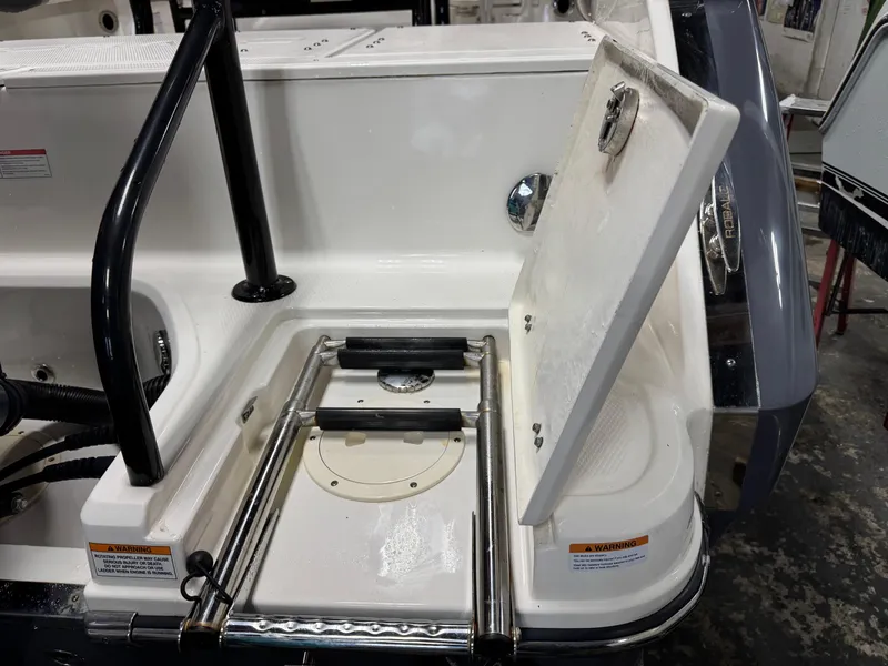 Slide: The Image of 2022 Robalo R230 Center Console boat with open swim platform ladder. - 33