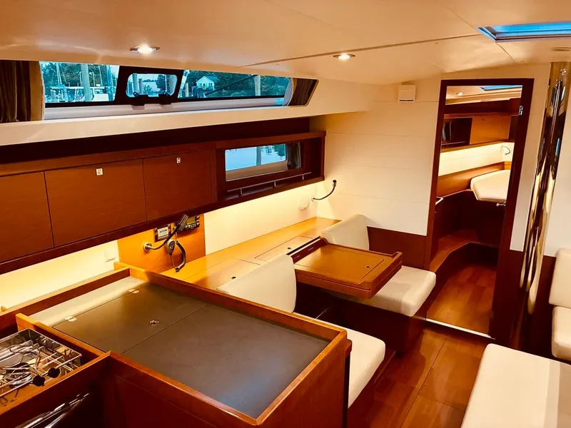 Slide: The Image of Interior of 2017 Beneteau Oceanis 45 yacht, featuring elegant wood finishes and modern design. - 12