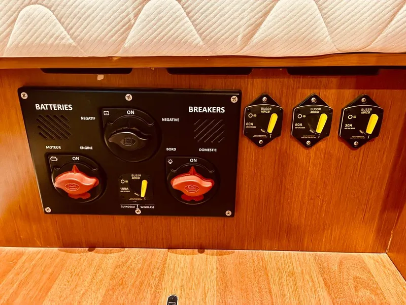 Slide: The Image of Electrical panel of a 2017 Beneteau Oceanis 45 yacht with battery and breaker switches. - 17