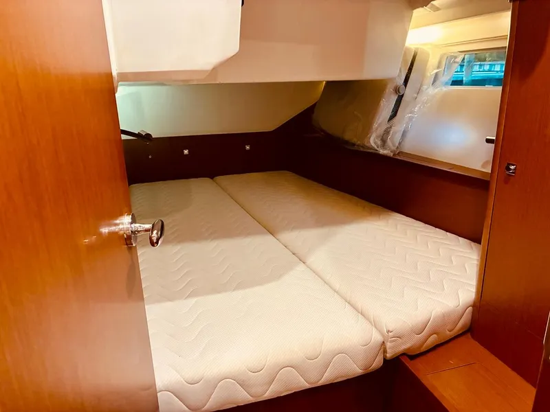 Slide: The Image of Cabin interior of 2017 Beneteau Oceanis 45 yacht with twin beds and wooden finish. - 21