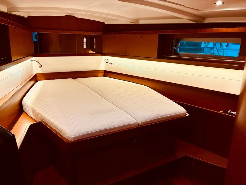 Slide: The Image of Luxurious cabin interior of 2017 Beneteau Oceanis 45 yacht with cozy bed. - 25