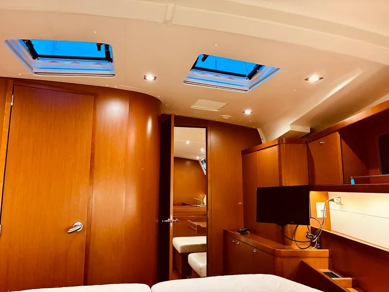 Slide: The Image of Interior of 2017 Beneteau Oceanis 45 yacht with wood finish and skylights. - 26