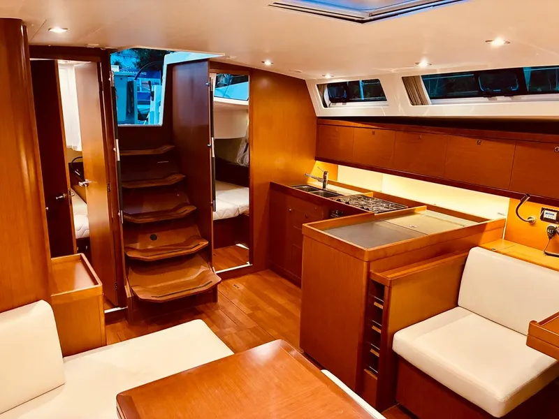 Slide: The Image of Luxurious interior of 2017 Beneteau Oceanis 45 yacht with modern kitchen and seating area. - 34