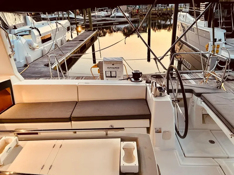 Slide: The Image of Cockpit view of 2017 Beneteau Oceanis 45 yacht docked at marina during sunset. - 38