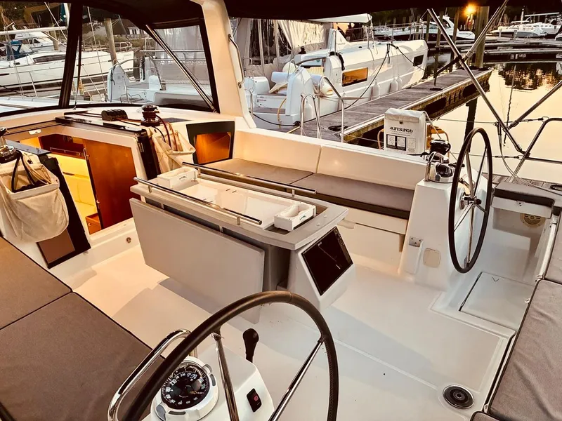 Slide: The Image of 2017 Beneteau Oceanis 45 yacht cockpit with dual steering wheels and modern design. - 39