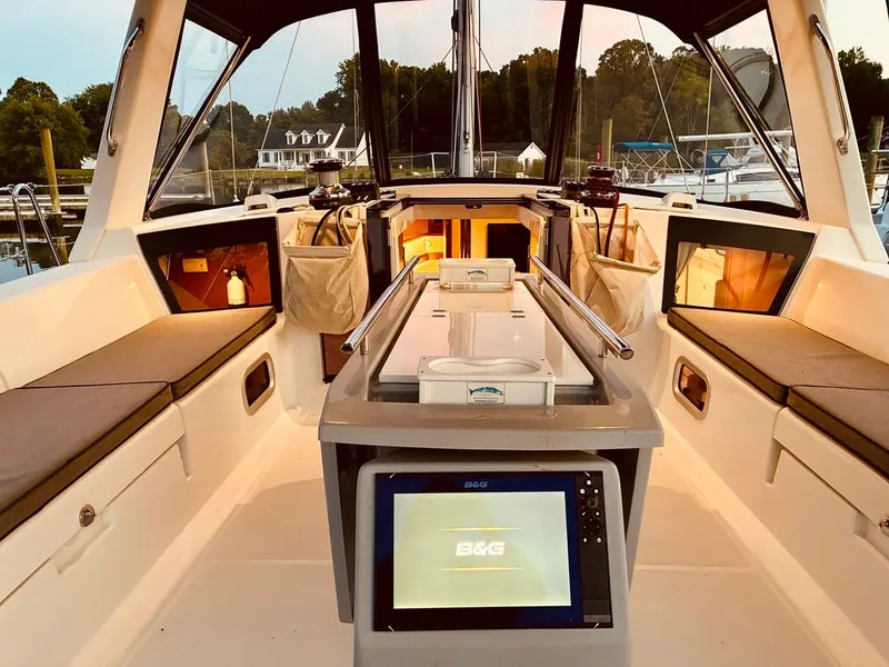 Slide: The Image of Interior view of 2017 Beneteau Oceanis 45 sailboat cockpit with seating and navigation equipment. - 40