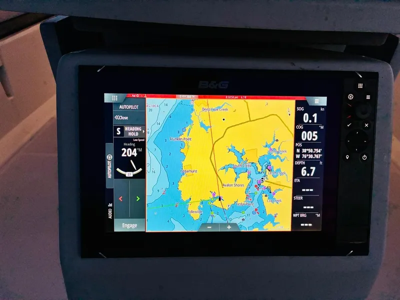 Slide: The Image of Navigation display on a 2017 Beneteau Oceanis 45 sailboat, showing map and heading details. - 44