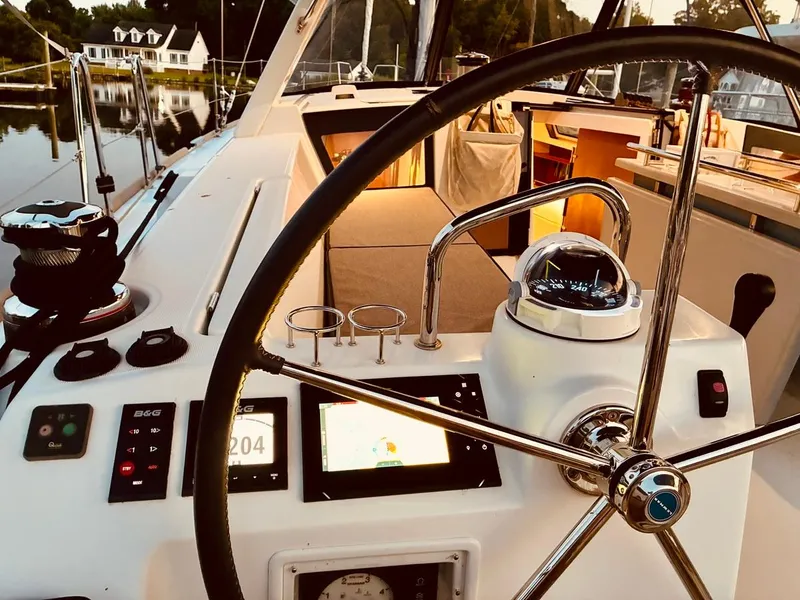 Slide: The Image of Steering wheel and navigation equipment on a 2017 Beneteau Oceanis 45 yacht. - 48