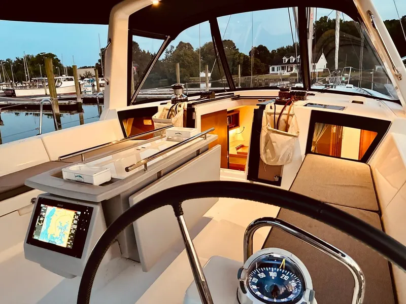 Slide: The Image of Interior view of 2017 Beneteau Oceanis 45 sailboat cockpit with navigation equipment. - 49