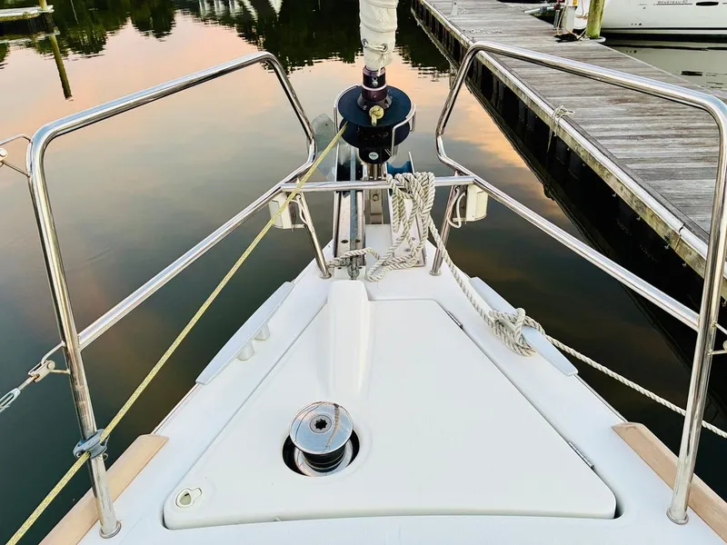 Slide: The Image of Bow of 2017 Beneteau Oceanis 45 yacht docked at marina, featuring stainless steel railings. - 5