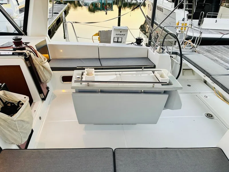 Slide: The Image of Beneteau Oceanis 45 cockpit, 2017 model, featuring seating and steering wheel at marina. - 6