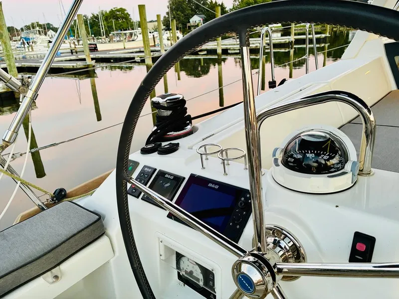 Slide: The Image of Steering wheel and navigation instruments on a 2017 Beneteau Oceanis 45 sailboat. - 7