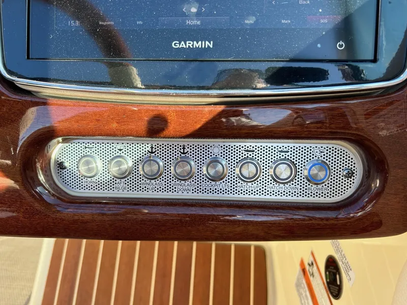 Slide: The Image of Dashboard of 2020 Chris-Craft 25 Launch GT with Garmin display and control buttons. - 7