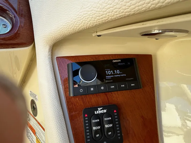 Slide: The Image of 2020 Chris-Craft 25 Launch GT dashboard with radio and control panel. - 8